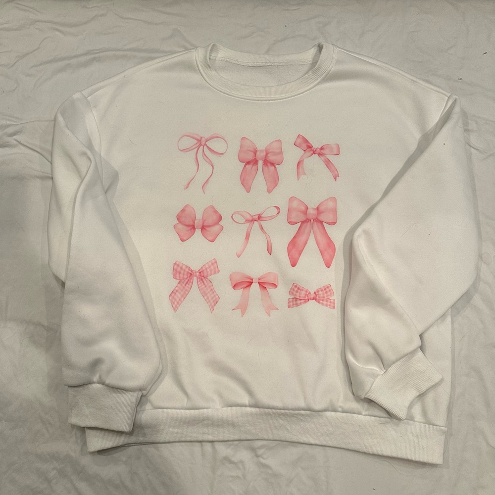 White Sweater with Pink Bow Design